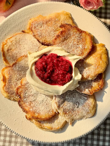 racuchy with cream and raspberry compote.