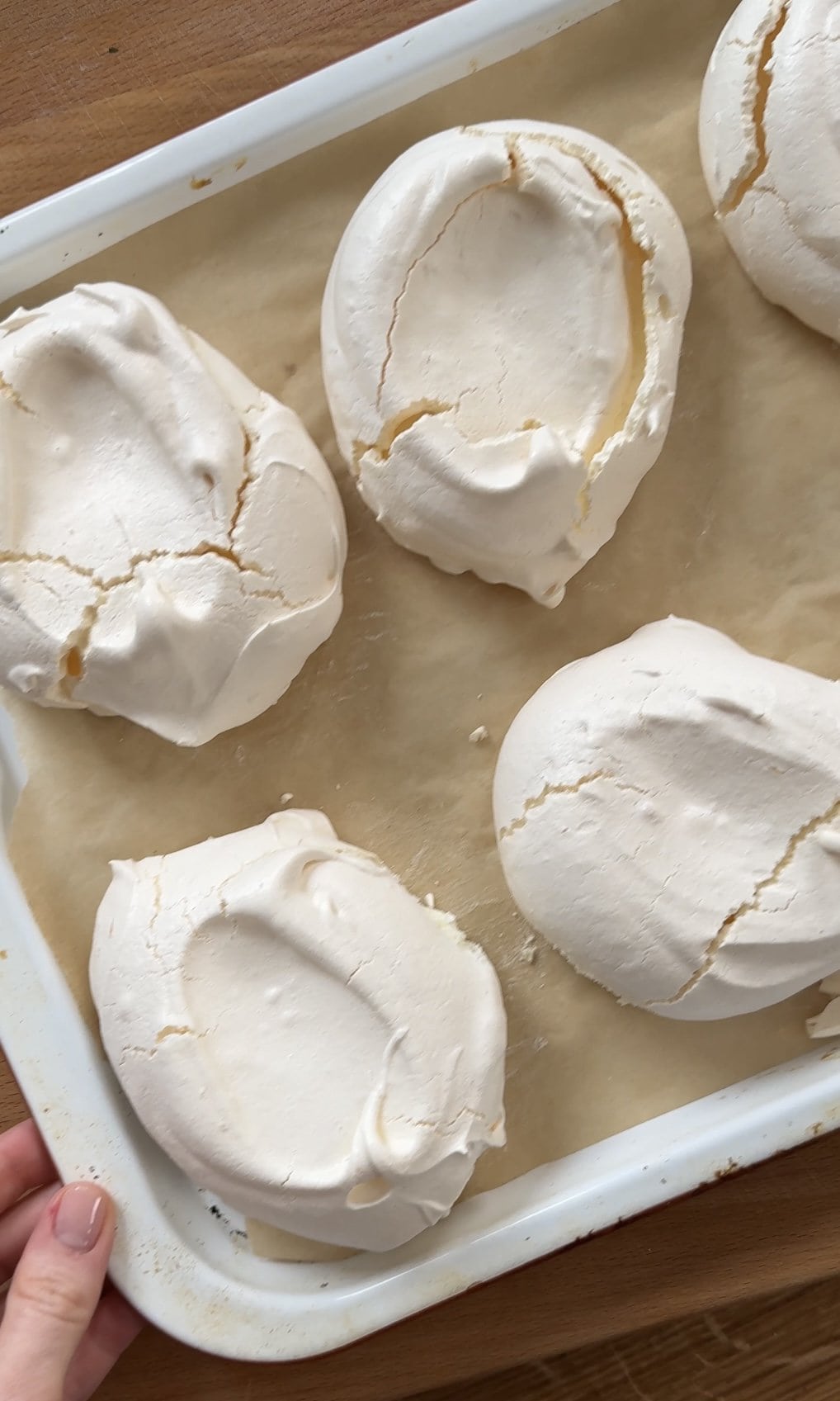 baked lemon meringues on baking tray.