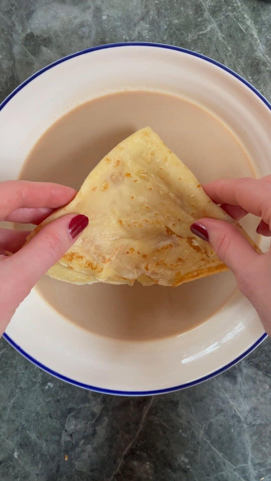 dipping pancake in coffee baileys soak.