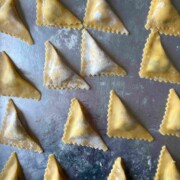 foldied triangoli on silver tray.