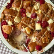 hot cross bun bread and butter pudding with a spoon.