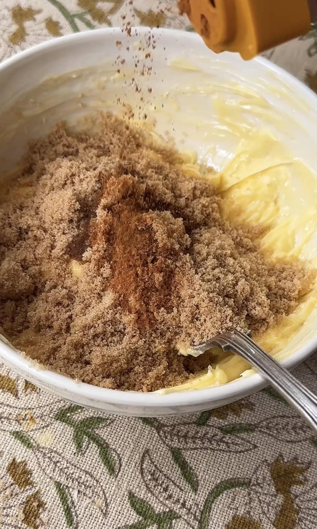 mashing butter and sugar.