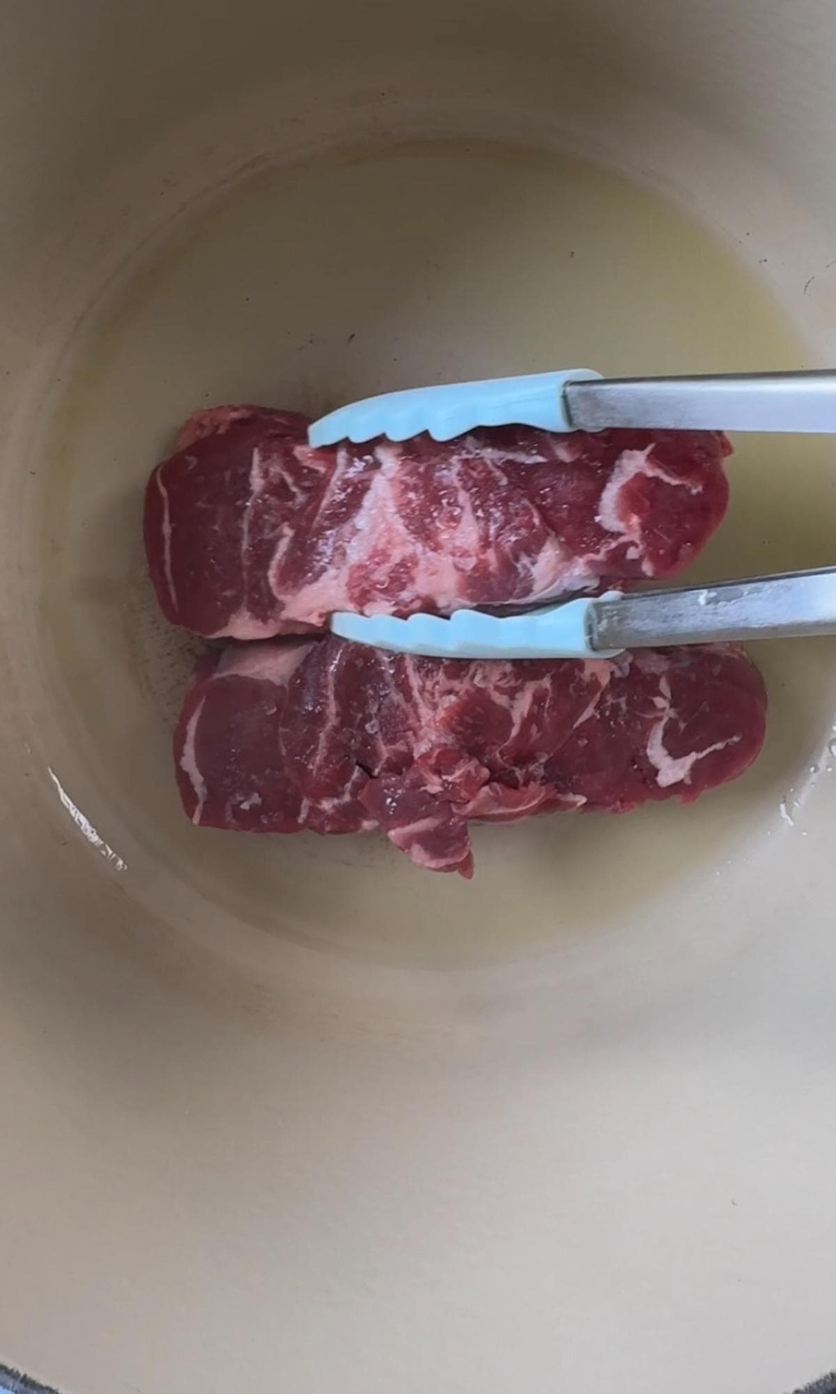 searing beef shin in oil.