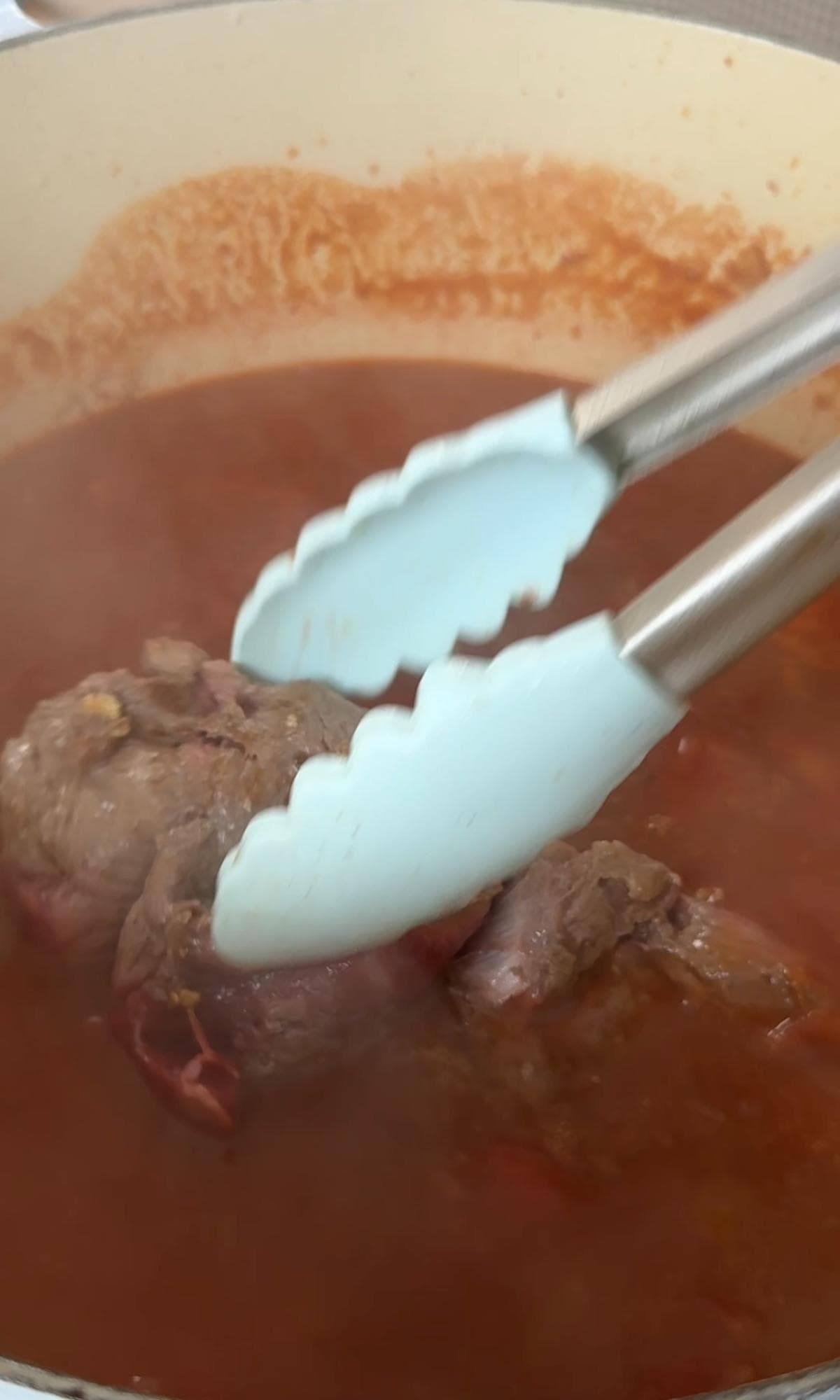 adding beef shin back to the ragu.