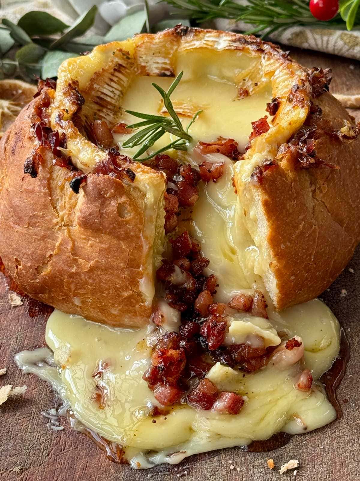 camembert roti in a loaf of bread.