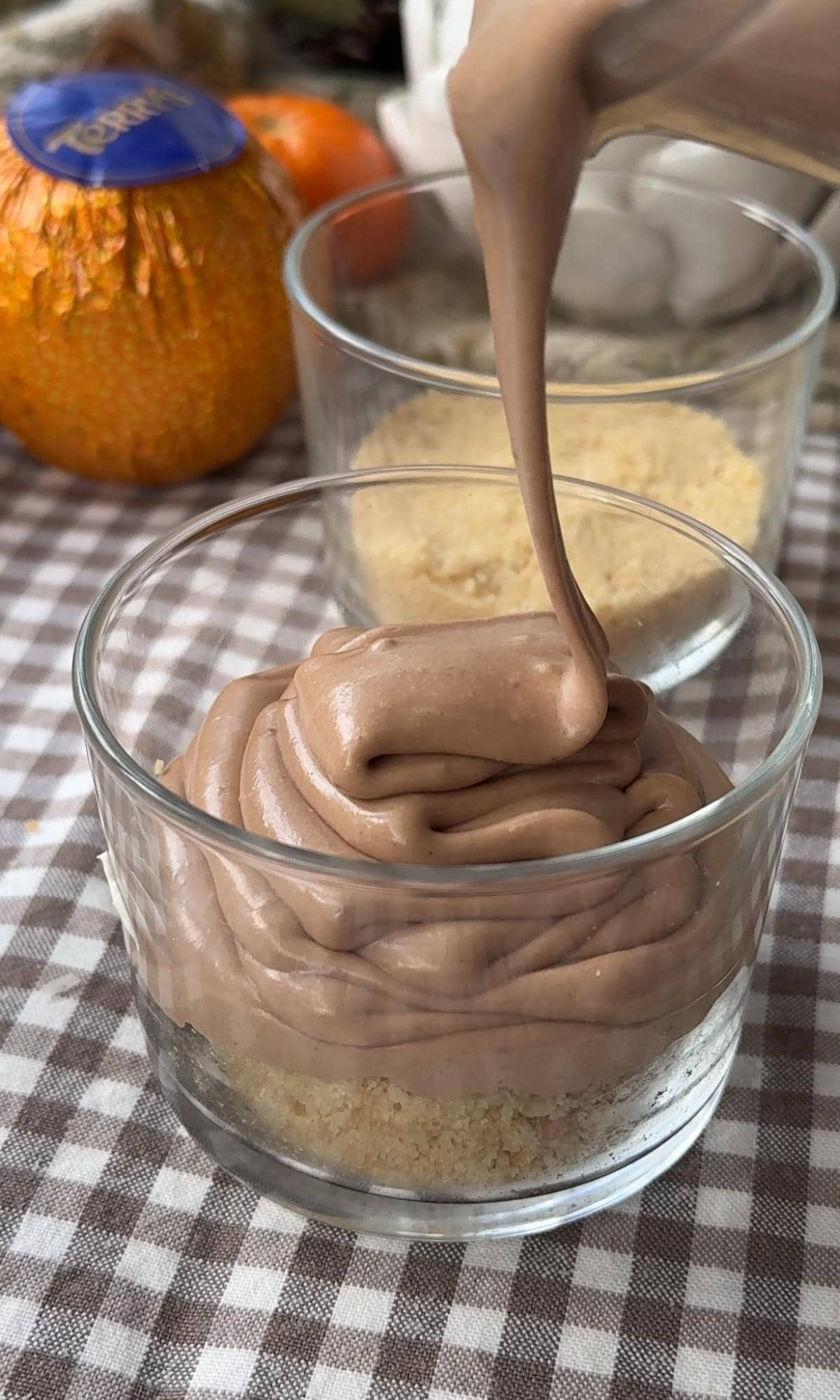 filling the chocolate orange cheesecake pots.
