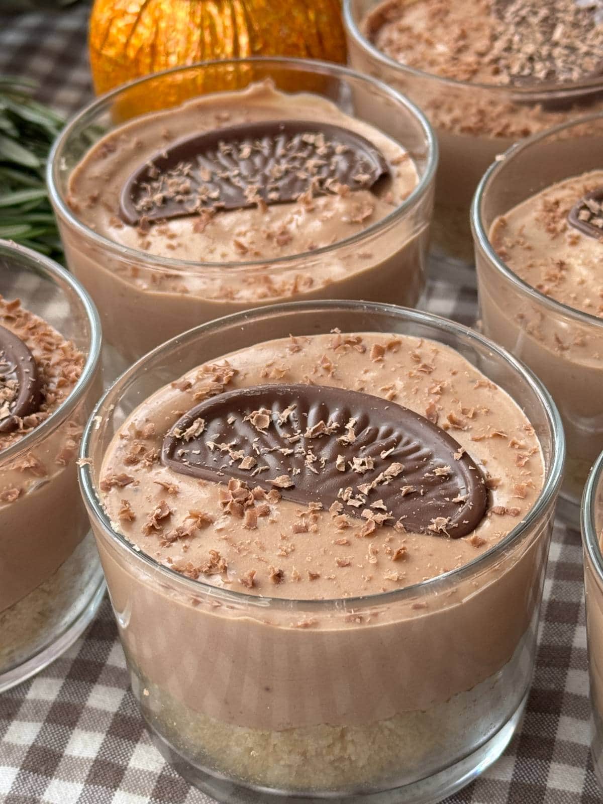 chocolate orange cheesecakes in small glass.