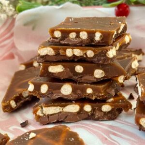 christmas pretzel crack stacked on a tray.