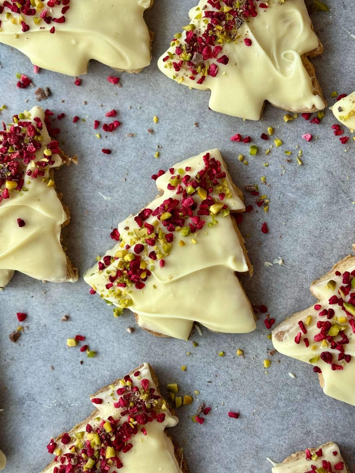 christmas tree cookies on a baking tray.