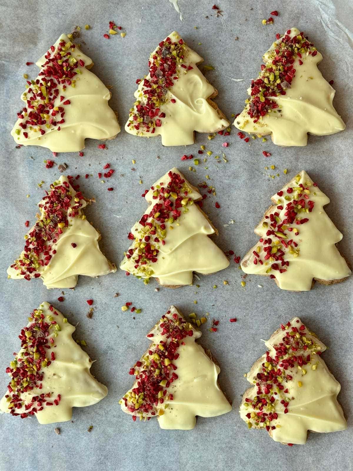 christmas tree cookies on a baking tray.