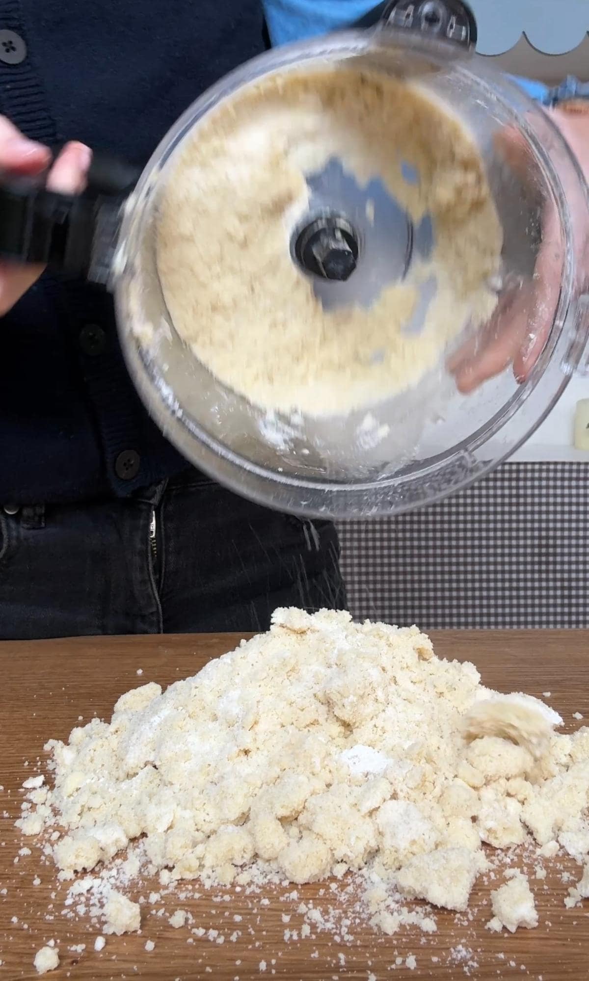 adding flour to the shortbread cookie dough.