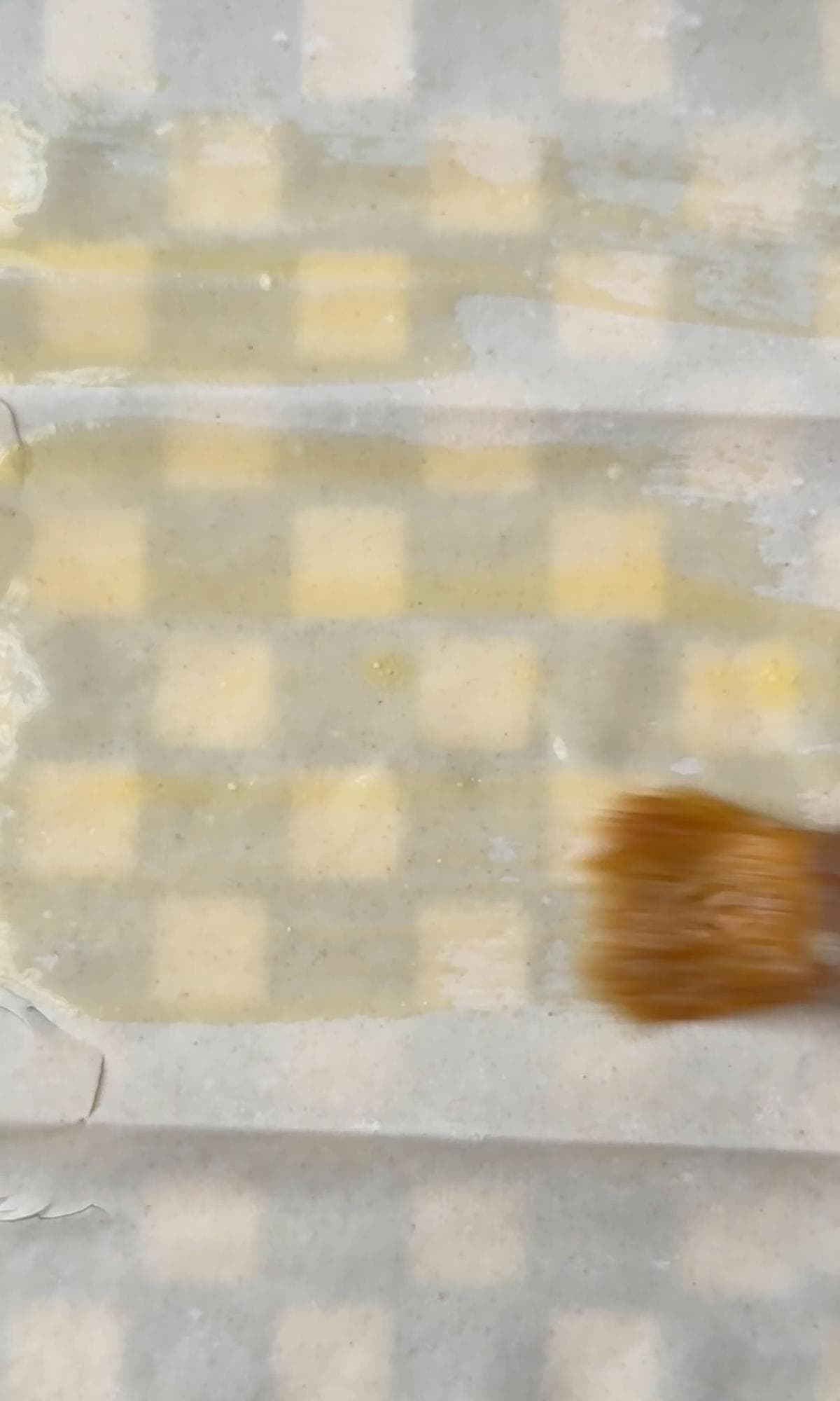 brushing filo sheets with butter.