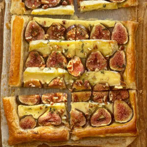 fig and brie tart on parchment paper.