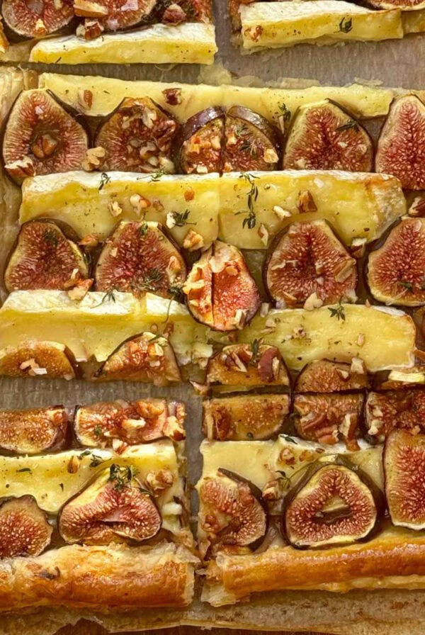 fig and brie tart on parchment paper.
