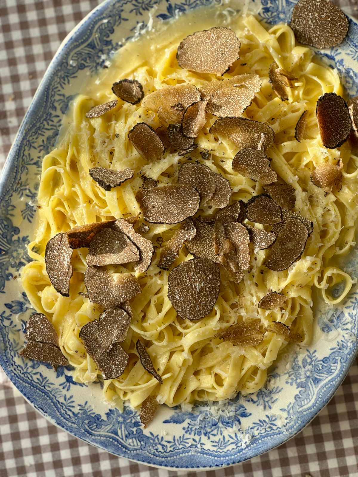 truffles with pasta on a plate.