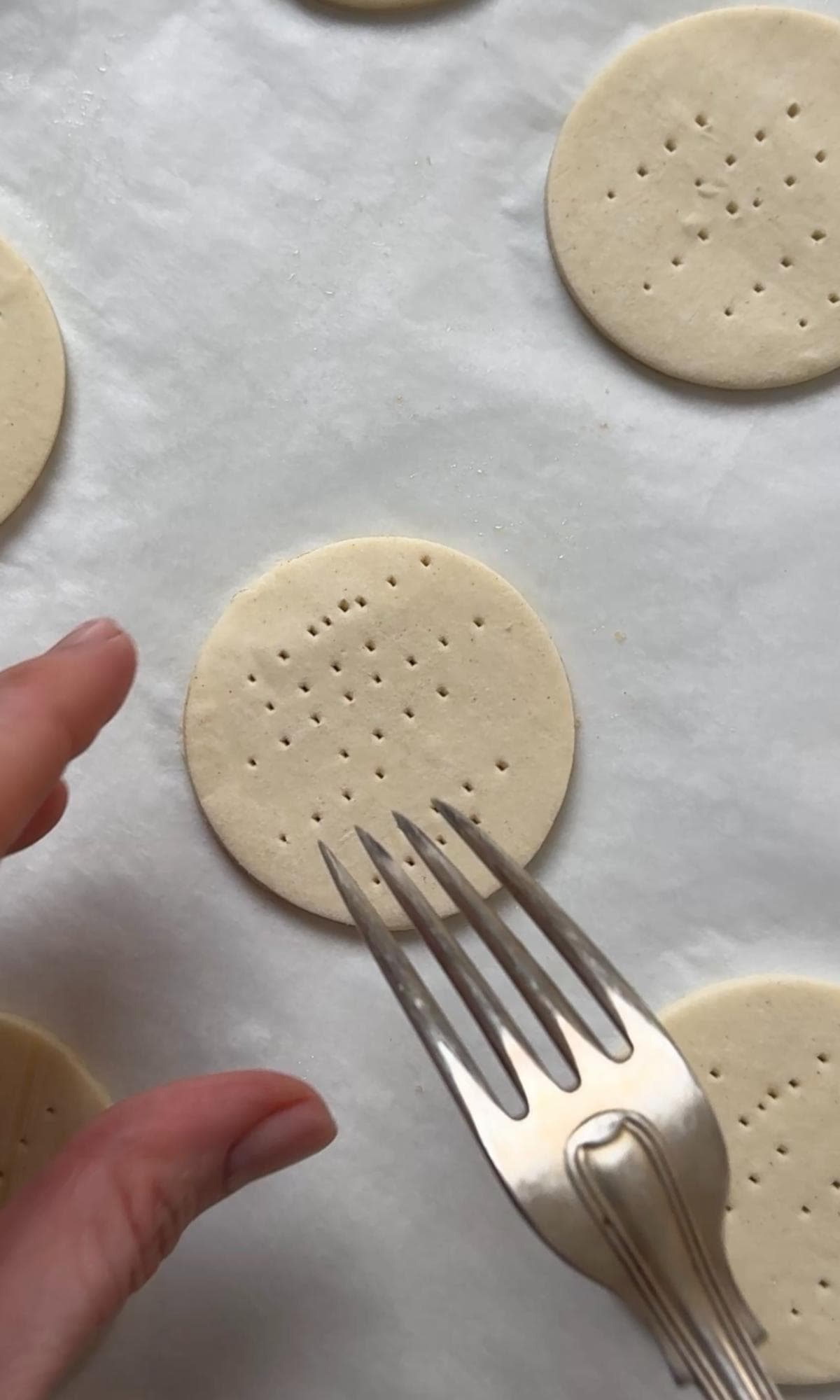 pricking puff pastry bases.