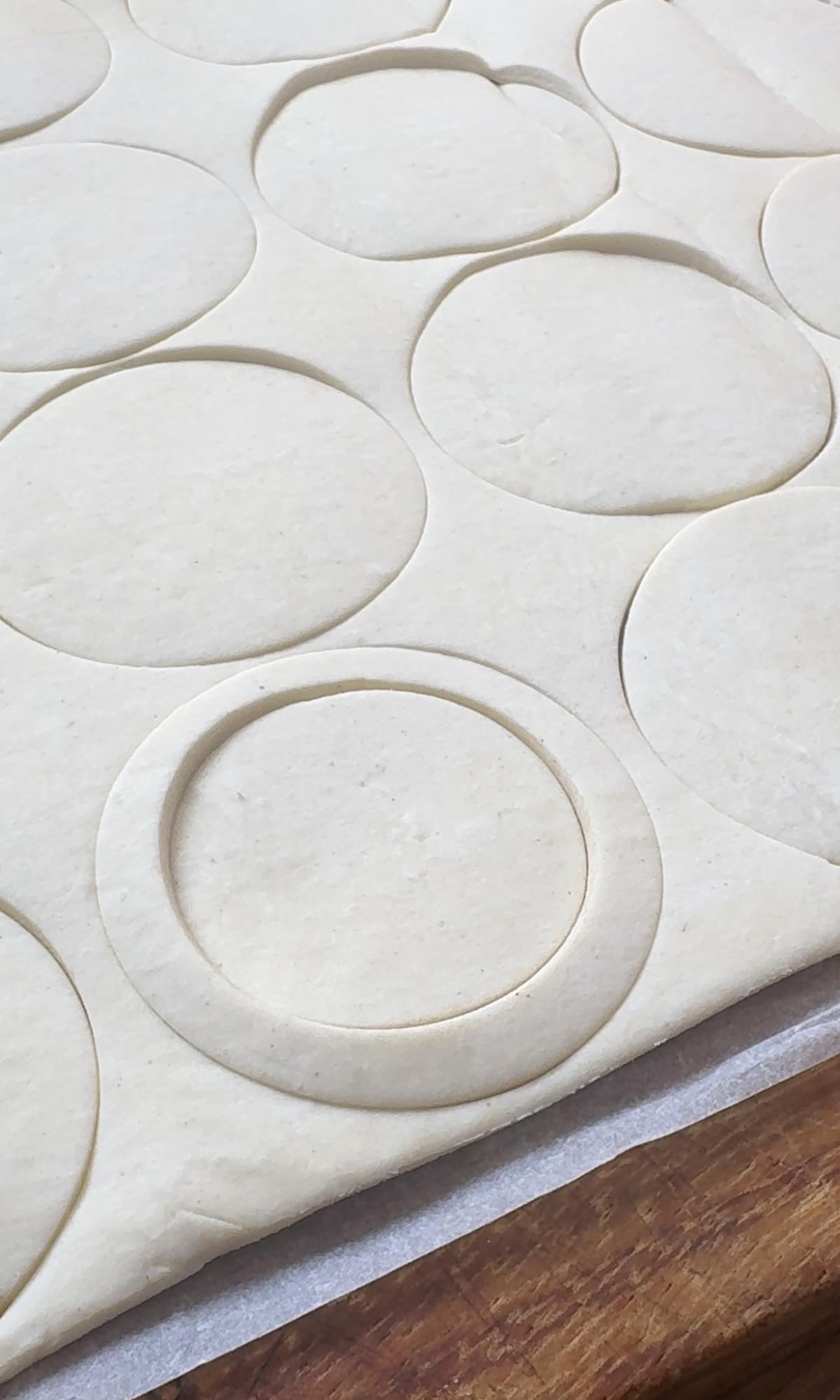 cutting out vol au vents pastry.