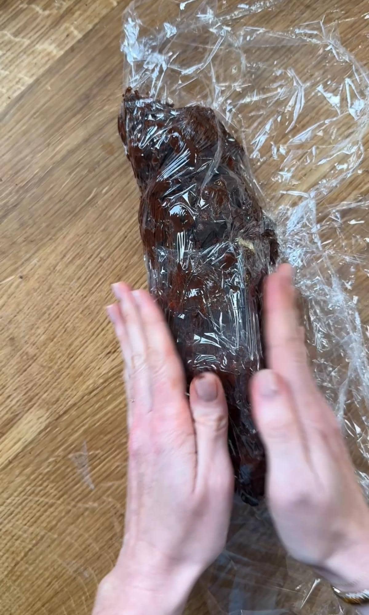 wrapping chocolate salami in cling film.