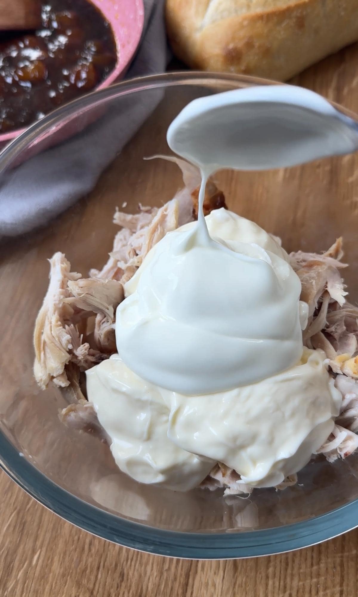 adding mayo and greek yoghurt to chicken.