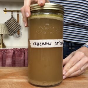 homemade chicken stock in a jar.