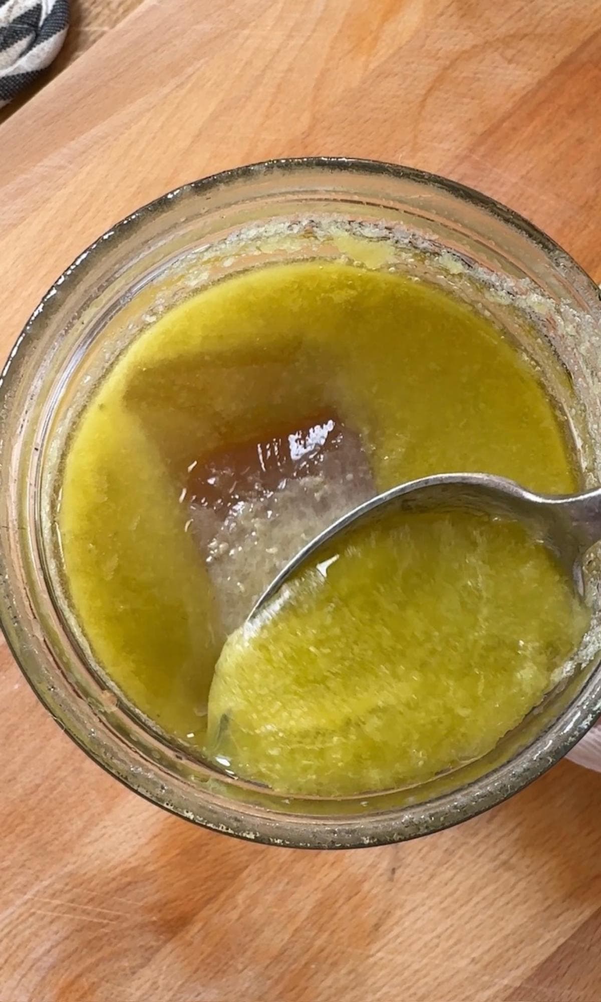 scraping fat off the chicken stock.