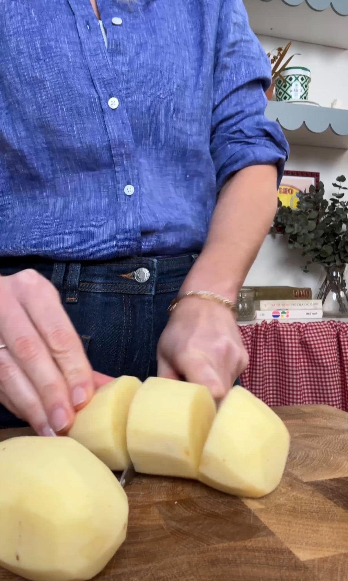 slicing white potatoes.