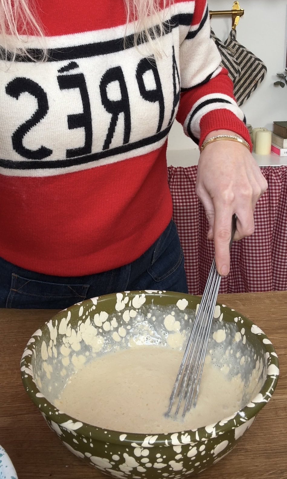 whisking the pancake batter.